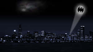 Illuminating Bat Signal In The Night Sky Wallpaper