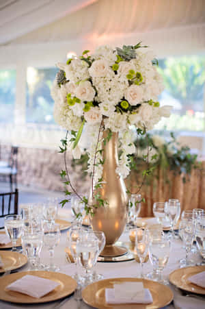 Illuminating The Table With A Elegant Centerpiece Wallpaper