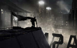 Image A City That Never Sleeps: Standing High Above Gotham City Wallpaper