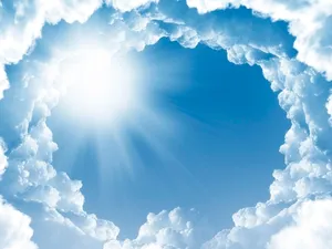 Image A Glistening Lake Surrounded By Lush Green Trees. Wallpaper