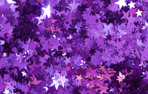 Image A Stunning Purple Star Twinkling In The Night Sky Wallpaper