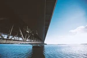 Image Concrete Bridge Spanning A Wide River Wallpaper