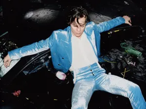 Image Harry Styles Working Hard On His Laptop Wallpaper