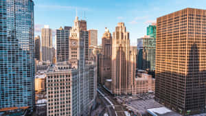 Image Vibrant Cityscape Of Chicago Taken During A Sunset Wallpaper