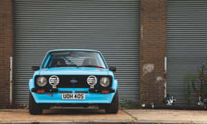 Immaculate Ford Escort On A Beautiful Day Wallpaper