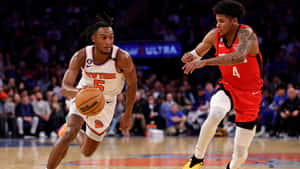 Immanuel Quickley Driving To Basket Wallpaper