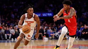 Immanuel Quickley Driving To Basket Wallpaper