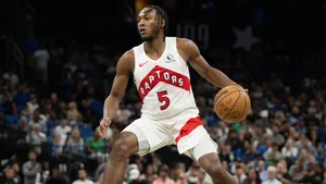 Immanuel Quickley Playing Basketball Wallpaper