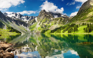 Immerse Yourself In Nature At This Beautiful Mountain Lake Wallpaper