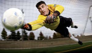 Impressive Save By Proactive Goalkeeper Wallpaper