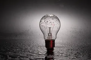 Incandescent Bulb On Wet Ground Wallpaper