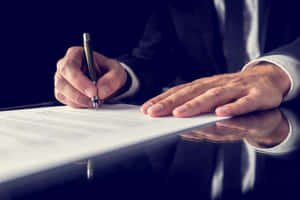 Incompetent Businessman Signing A Contract Wallpaper