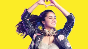 Indian Actress Shraddha Kapoor Posing In A Glamorous Dress. Wallpaper