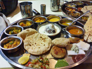 Indian Vegetarian Thali Assortment Wallpaper