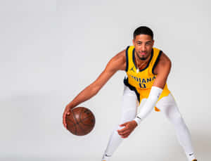 Indiana Pacers Basketball Player Dribbling Wallpaper