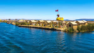 Indigenous Community Within The Breathtaking Environment Of Lake Titicaca. Wallpaper