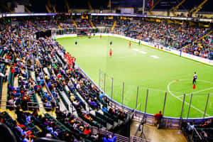 Indoor Soccer Game In Action Wallpaper