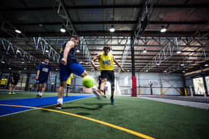Indoor Soccer Match In Action Wallpaper