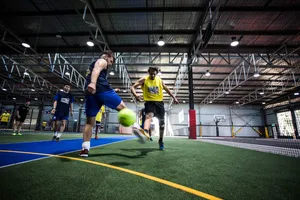 Indoor Soccer Match In Action Wallpaper