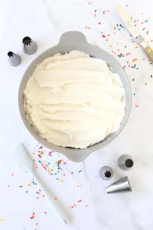Indulge In The Sweetest Treat: A Big Slice Of Deliciously Soft Buttercream Cake Wallpaper
