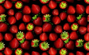 Indulge In The Sweetness Of Stawberries Wallpaper