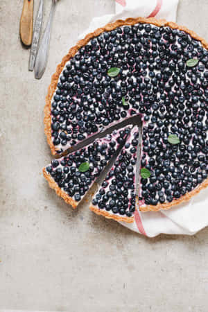 Indulge In This Delicious Delight Of Blueberry-filled Tart! Wallpaper