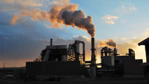 Industrial Smokestacks Emissionsat Dusk.jpg Wallpaper