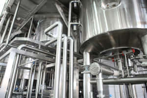 Industrial Stainless Steel Pipingand Vats Wallpaper