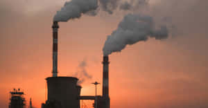 Industrial Sunset Smokestacks Wallpaper