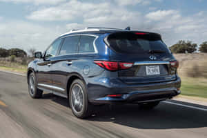 Infiniti Qx60 Luxury Suv On Scenic Road Wallpaper