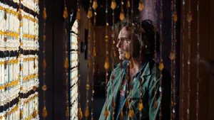 Inherent Vice Scene With Beaded Curtains Wallpaper
