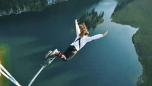 Inspiring And Adventurous Cliff Diver Wallpaper