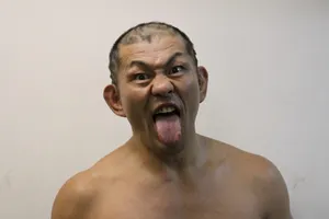 Intense Action Shot Of Wrestler Minoru Suzuki Wallpaper