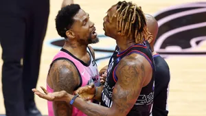 Intense Basketball Court Confrontation Wallpaper