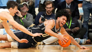 Intense Basketball Game Dive Wallpaper