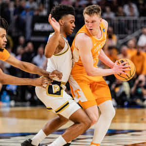 Intense Basketball Matchup Wallpaper