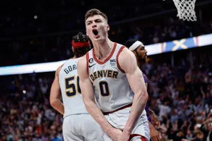 Intense Basketball Player Celebration Wallpaper