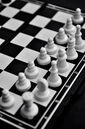 Intense Battle On A Black And White Chessboard Wallpaper