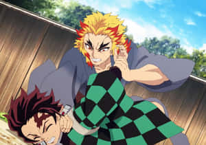 Intense Battle Scene Between Rengoku And Tanjiro Wallpaper