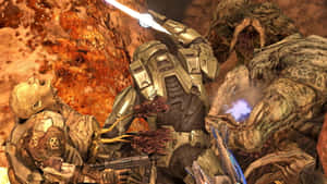 Intense Battle Scene With Halo Flood Creatures In Action Wallpaper