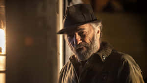 Intense Character Portraitwith Hat Wallpaper