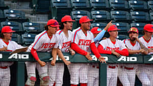 Intense College Baseball Game On A Sunny Day Wallpaper