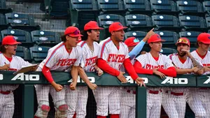 Intense College Baseball Game On A Sunny Day Wallpaper