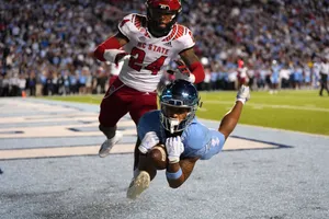 Intense College Football Matchup Wallpaper