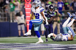 Intense Football Action Dallasvs Seattle Wallpaper