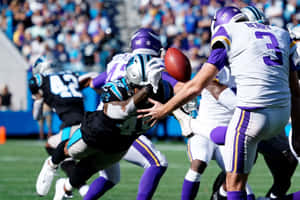 Intense Football Action Fumble Wallpaper