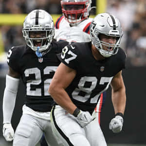 Intense Football Action Raiders Game Wallpaper