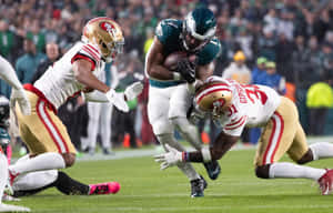 Intense Football Action Tackle Wallpaper