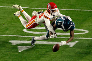 Intense Football Actiononthe Field Wallpaper