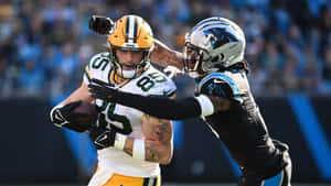 Intense Football Matchup Wallpaper